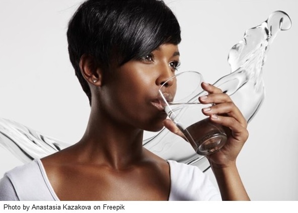 Black womandrinking water